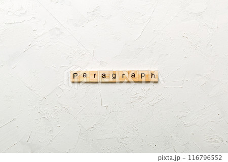 paragraph word written on wood block. paragraph text on table, concept paragraph word written on wood block. paragraph text on table, concept 116796552