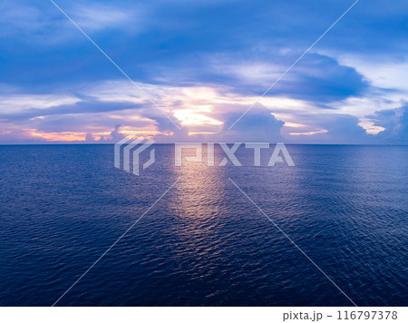 Landscape Aerial view of majestic clouds in the sky sunset or sunrise over sea with reflection in the tropical sea Landscape Aerial view of majestic clouds in the sky sunset or sunrise over sea with reflection in the tropical sea 116797378