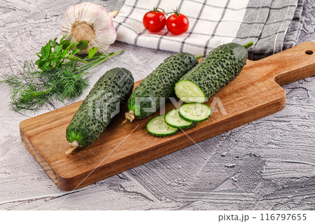 Raw green cucumbers with slices 116797655