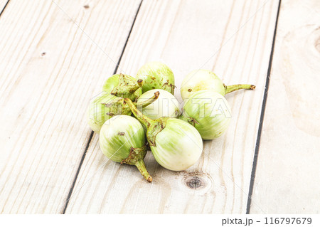 Small organic young green round eggplant 116797679