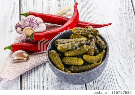 Marinated small cucumbers in the bowl Marinated small cucumbers in the bowl 116797680