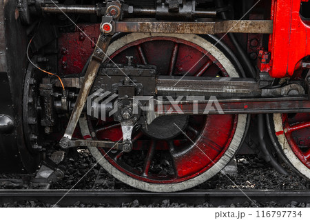 Wheel and power details of vintage steam locomotive, close-up 116797734