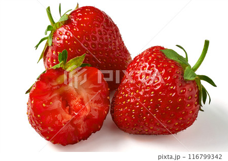 Fragrant ripe strawberry whole and bitten close-up isolated on a white background. Berry antioxidant Fragrant ripe strawberry whole and bitten close-up isolated on a white background. Berry antioxidant 116799342