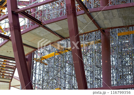 Scaffolding on the construction site of an engineering structure. Scaffolding on the construction site of an engineering structure. 116799356