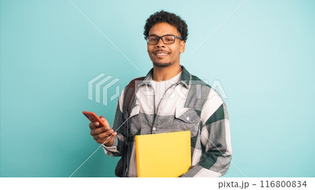 Cheerful male student displaying scholarship money in blue studio 116800834