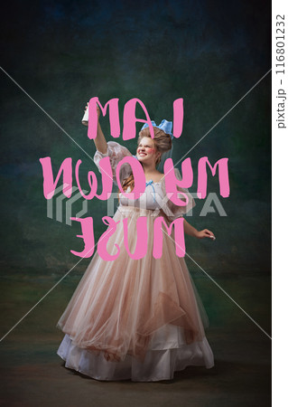 Emotional young woman in vintage dress making motivational quotation i am my own muse against dark textured green background Emotional young woman in vintage dress making motivational quotation i am my own muse against dark textured green background 116801232