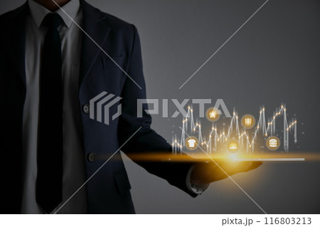 Businessman Hand Hold Tablet and Stock Market Graph and Online Products 116803213