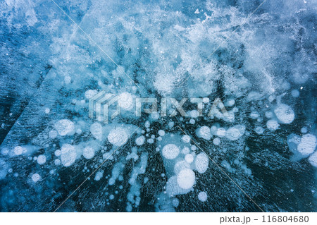 Natural methane bubbles in frozen lake on winter Natural methane bubbles in frozen lake on winter 116804680