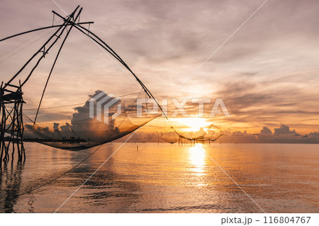 Villager large fish net lifting in Songkhla lake, Phatthalung, Thailand. 116804767