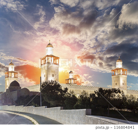 King Hussein Bin Talal mosque in Amman (at night), Jordan. Against the background of a beautiful sky with clouds King Hussein Bin Talal mosque in Amman (at night), Jordan. Against the background of a beautiful sky with clouds 116804841