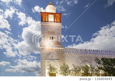 King Hussein Bin Talal mosque in Amman (at night), Jordan. Against the background of a beautiful sky with clouds King Hussein Bin Talal mosque in Amman (at night), Jordan. Against the background of a beautiful sky with clouds 116804843