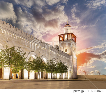 King Hussein Bin Talal mosque in Amman (at night), Jordan. Against the background of a beautiful sky with clouds King Hussein Bin Talal mosque in Amman (at night), Jordan. Against the background of a beautiful sky with clouds 116804870