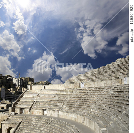 Roman Theatre in Amman, Jordan -- theatre was built the reign of Antonius Pius (138-161 CE), the large and steeply raked structure could seat about 6000 people. Against the sky with clouds 116804929