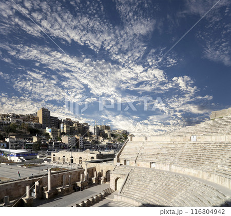 Roman Theatre in Amman, Jordan -- theatre was built the reign of Antonius Pius (138-161 CE), the large and steeply raked structure could seat about 6000 people. Against the sky with clouds 116804942