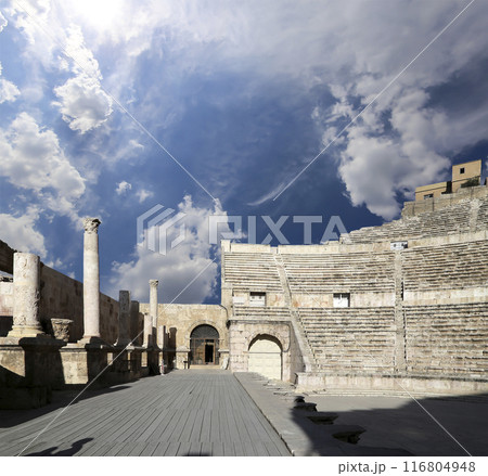 Roman Theatre in Amman, Jordan -- theatre was built the reign of Antonius Pius (138-161 CE), the large and steeply raked structure could seat about 6000 people. Against the sky with clouds 116804948