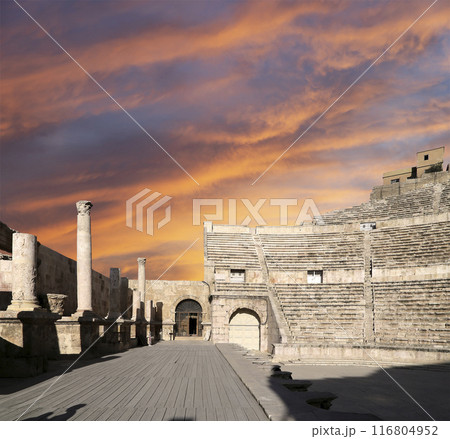 Roman Theatre in Amman, Jordan -- theatre was built the reign of Antonius Pius (138-161 CE), the large and steeply raked structure could seat about 6000 people. Against the sky with clouds 116804952