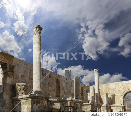 Roman Theatre in Amman, Jordan -- theatre was built the reign of Antonius Pius (138-161 CE), the large and steeply raked structure could seat about 6000 people. Against the sky with clouds 116804973
