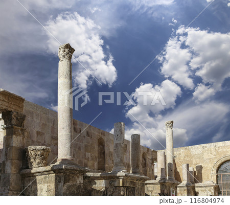 Roman Theatre in Amman, Jordan -- theatre was built the reign of Antonius Pius (138-161 CE), the large and steeply raked structure could seat about 6000 people. Against the sky with clouds Roman Theatre in Amman, Jordan -- theatre was built the reign of Antonius Pius (138-161 CE), the large and steeply raked structure could seat about 6000 people. Against the sky with clouds 116804974
