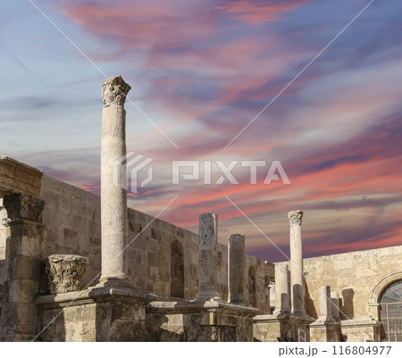 Roman Theatre in Amman, Jordan -- theatre was built the reign of Antonius Pius (138-161 CE), the large and steeply raked structure could seat about 6000 people. Against the sky with clouds 116804977
