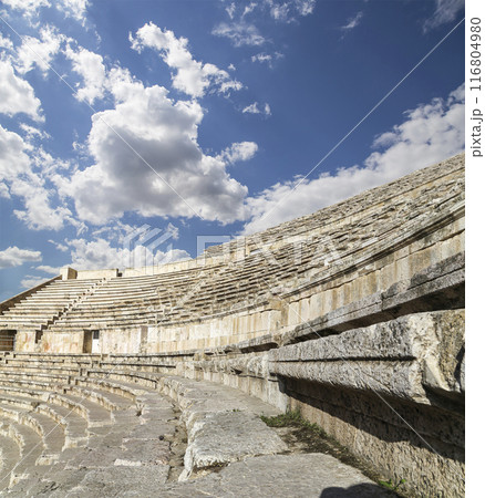 Roman Theatre in Amman, Jordan -- theatre was built the reign of Antonius Pius (138-161 CE), the large and steeply raked structure could seat about 6000 people. Against the sky with clouds Roman Theatre in Amman, Jordan -- theatre was built the reign of Antonius Pius (138-161 CE), the large and steeply raked structure could seat about 6000 people. Against the sky with clouds 116804980