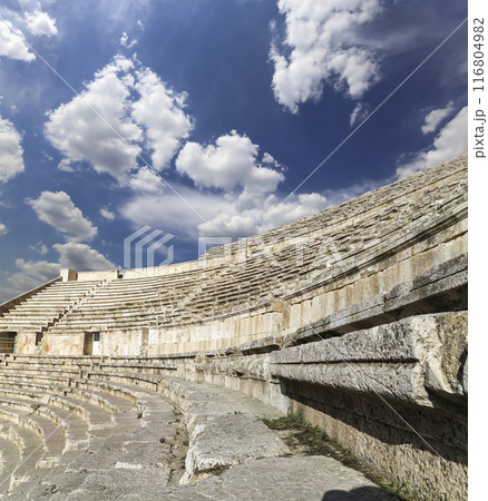 Roman Theatre in Amman, Jordan -- theatre was built the reign of Antonius Pius (138-161 CE), the large and steeply raked structure could seat about 6000 people. Against the sky with clouds 116804982