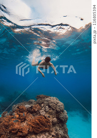 60s woman snorkeling and diving in blue sea. Snorkeling at vacation 60s woman snorkeling and diving in blue sea. Snorkeling at vacation 116805394