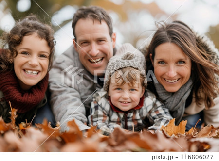 Happy Family In Autumn Leaves 116806027