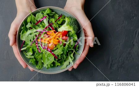 Hands Holding a Fresh Green Salad Hands Holding a Fresh Green Salad 116806041
