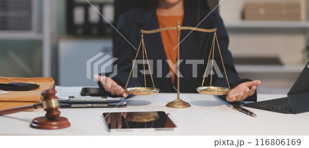 Judge gavel with Justice lawyers having team meeting at law firm background. Concepts of Law and Legal services. 116806169