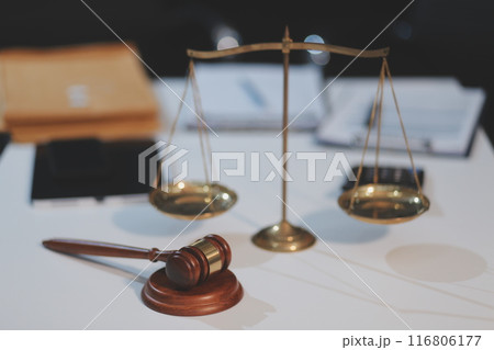 Judge gavel with Justice lawyers having team meeting at law firm background. Concepts of Law and Legal services. 116806177