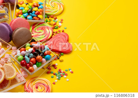 Various colorful candies, lollipops, and macaroons 116806318