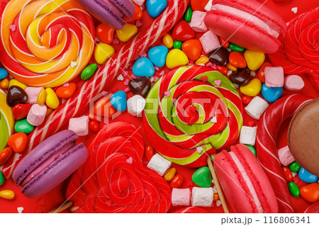 Various colorful candies, lollipops, and macaroons Various colorful candies, lollipops, and macaroons 116806341