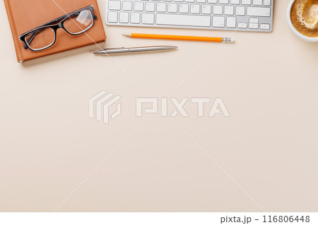 Office desk table with computer, cup of coffee and supplies 116806448
