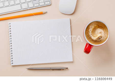 Office desk table with notepad, cup of coffee and supplies 116806449