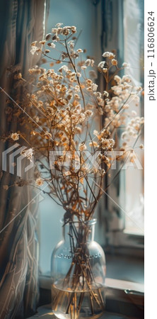 Sunlit Vintage Glass Vase with Dried Flowers by Window 116806624