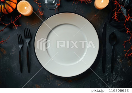 Autumn-Themed Table Setting with Pumpkins and Fall Leaves 116806638