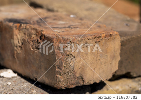 old used bricks made of red clay and other materials 116807582