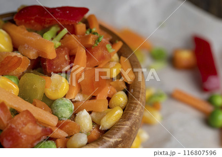a mixture of quick-frozen corn, peas, peppers, and carrots a mixture of quick-frozen corn, peas, peppers, and carrots 116807596