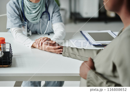 Doctor holding hand of pregnant patient Doctor holding hand of pregnant patient 116808652