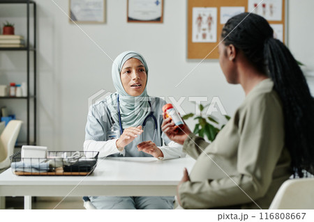 Consulting patient about new pills 116808667