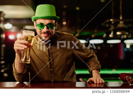 Toasting for Saint Patrick day in pub 116808694