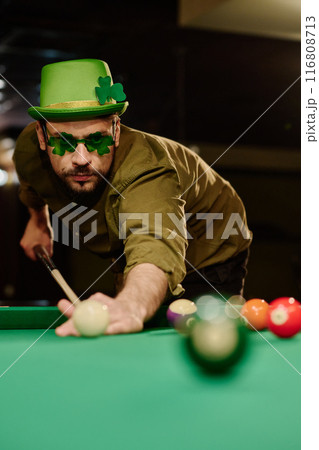 Player in green hat and shamrock eyewear Player in green hat and shamrock eyewear 116808713
