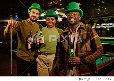 Happy friends holding bottles of beer 116808735