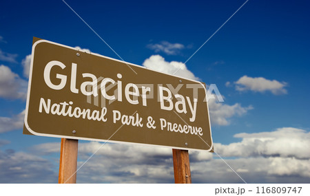 Glacier Bay National Park and Preserve (Alaska) Road Sign Against Blue Sky and Clouds. 116809747