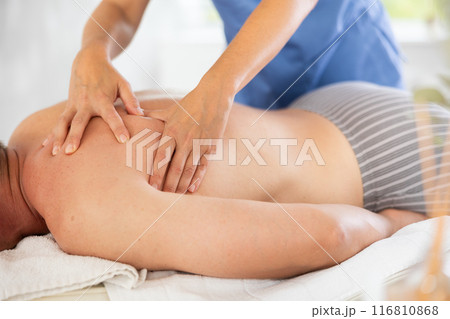 the client lies while the worker gives a massage the client lies while the worker gives a massage 116810868
