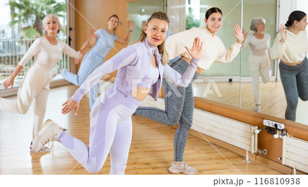 Positive people practicing vigorous lindy hop movements in dance class Positive people practicing vigorous lindy hop movements in dance class 116810938