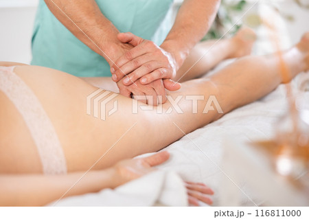 the client lies while the worker gives a massage 116811000