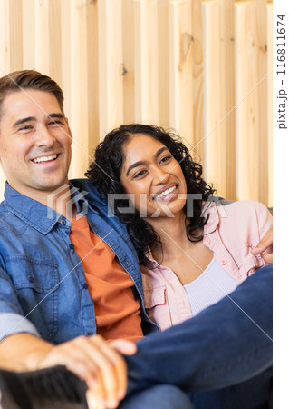 Sitting together, smiling couple enjoying quality time indoors 116811674