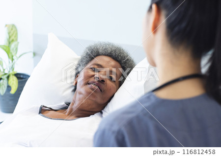 Senior African American woman lies in a hospital bed, with copy space Senior African American woman lies in a hospital bed, with copy space 116812458
