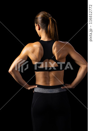 Athlete displays toned back, highlighting strength and health dedication. 116812772